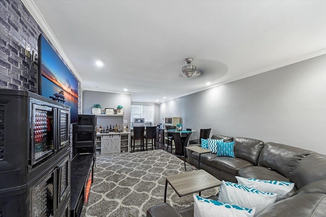 living room with bar and ornamental molding