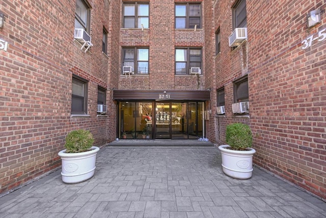 doorway to property featuring cooling unit