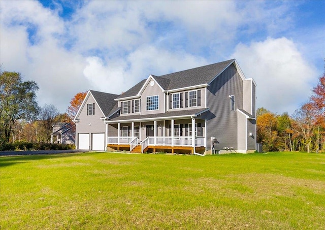 view of front facade with a garage, covered porch, and a front lawn