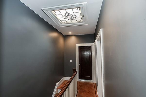 hallway featuring parquet flooring