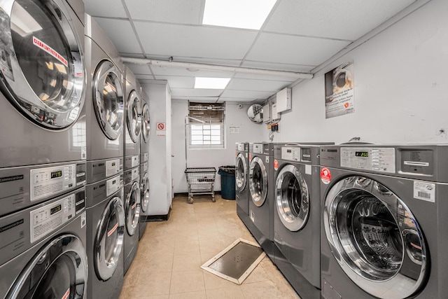 washroom featuring separate washer and dryer and stacked washer / drying machine