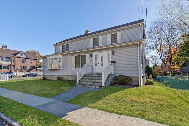 view of front of home featuring a front yard