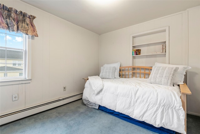 carpeted bedroom with a baseboard heating unit