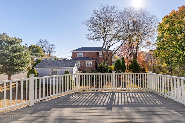 wooden terrace with an outbuilding