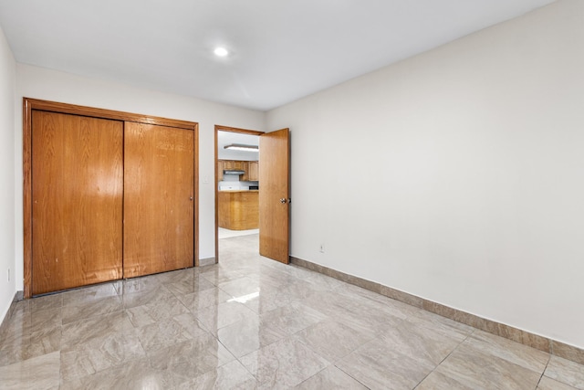 unfurnished bedroom featuring a closet