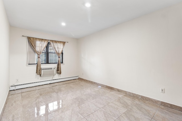 spare room featuring a wall unit AC and a baseboard radiator