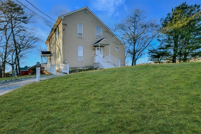 view of front of property with a front lawn