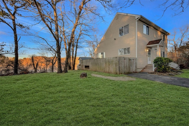 view of property exterior featuring a lawn