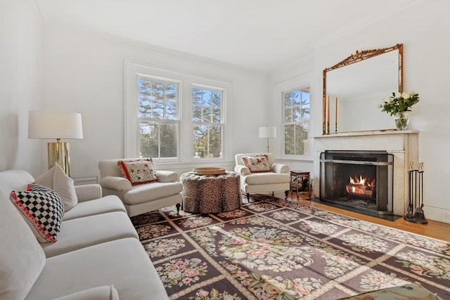 living room featuring hardwood / wood-style flooring and ornamental molding