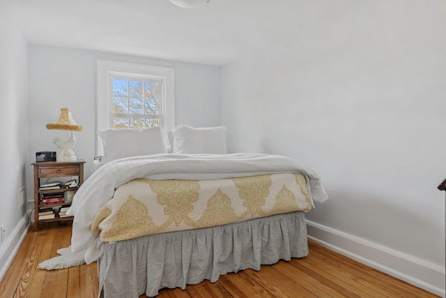 bedroom with hardwood / wood-style floors