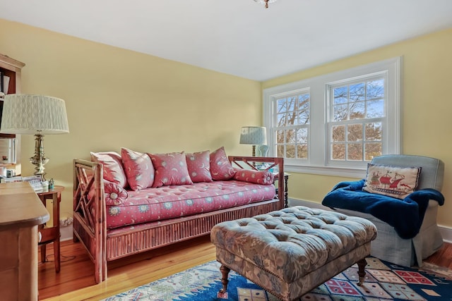 living room with plenty of natural light and light hardwood / wood-style floors