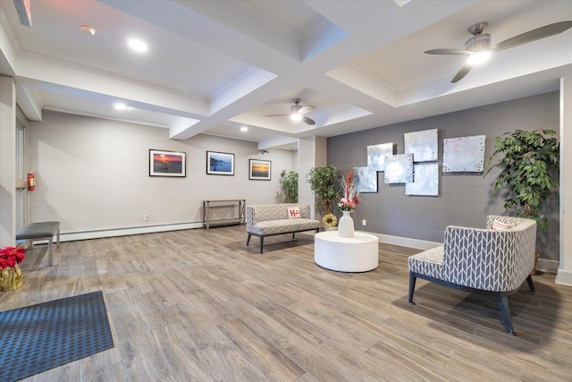 living area featuring a baseboard radiator, light hardwood / wood-style flooring, beam ceiling, ceiling fan, and coffered ceiling