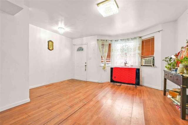 entryway featuring wood-type flooring and cooling unit