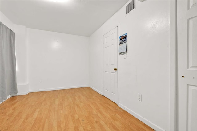 spare room featuring light wood-type flooring