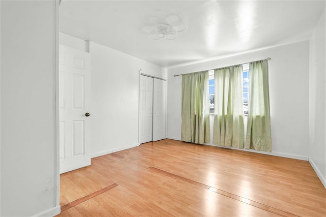 unfurnished room featuring wood-type flooring