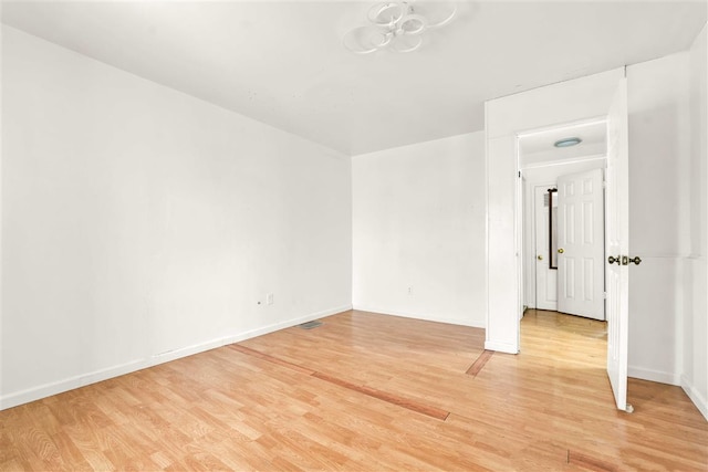 unfurnished room featuring hardwood / wood-style flooring