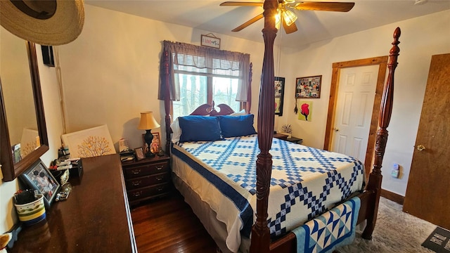 bedroom with ceiling fan and dark hardwood / wood-style floors