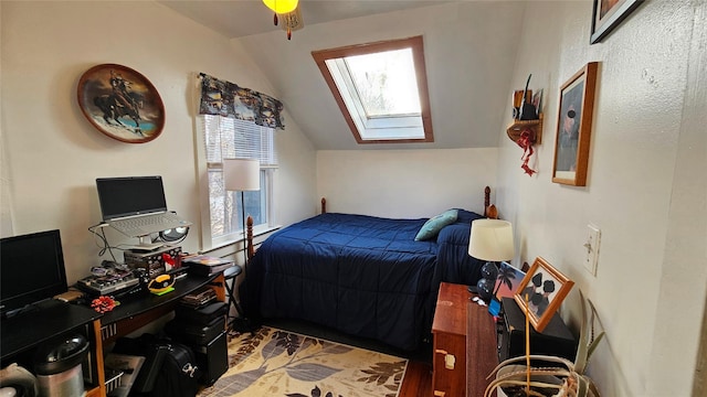 bedroom featuring lofted ceiling with skylight