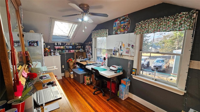 office area with ceiling fan, vaulted ceiling, a healthy amount of sunlight, and hardwood / wood-style floors