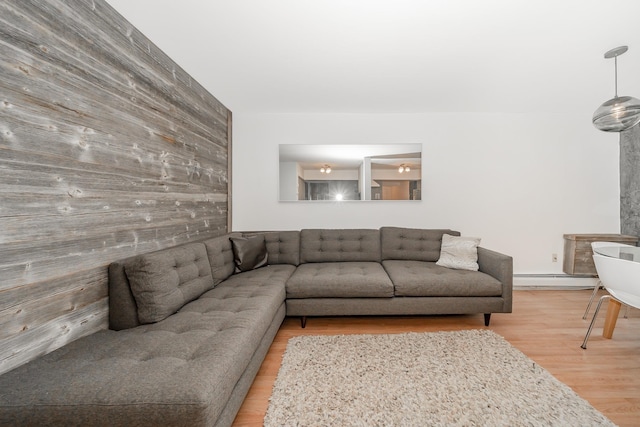 living room with hardwood / wood-style flooring and a baseboard radiator