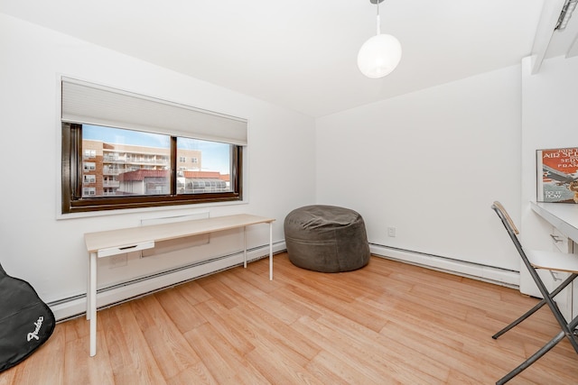 office area featuring hardwood / wood-style flooring and a baseboard radiator