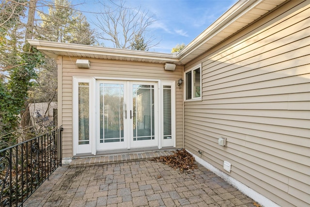 view of exterior entry featuring french doors