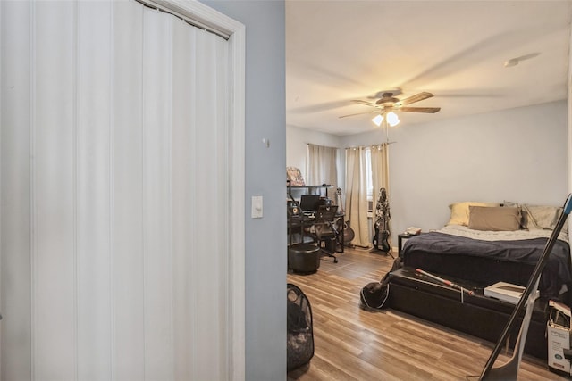 bedroom featuring wood-type flooring and ceiling fan