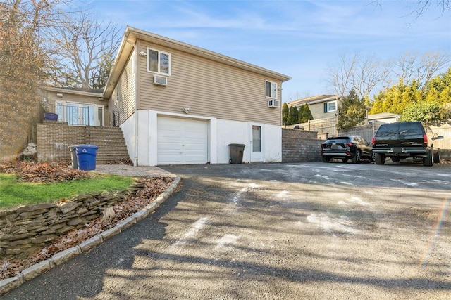 view of property exterior featuring a garage