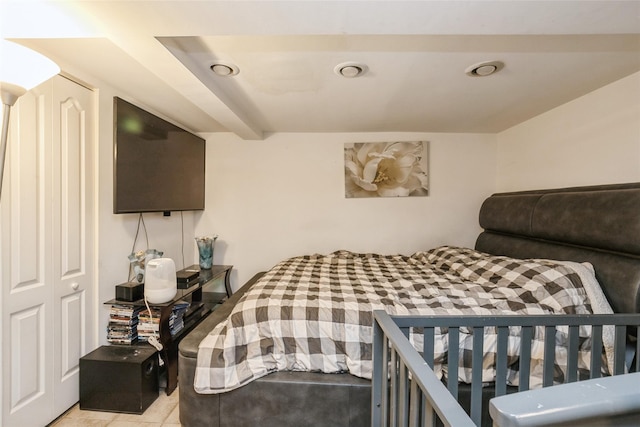 bedroom with light tile patterned flooring