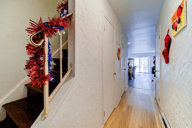 corridor featuring light hardwood / wood-style floors