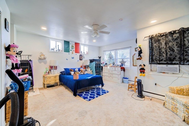 bedroom featuring ceiling fan, cooling unit, a baseboard radiator, and carpet flooring