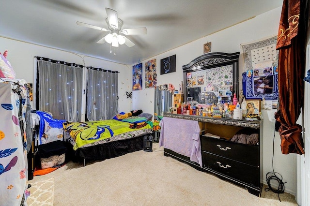 bedroom with ceiling fan and carpet flooring