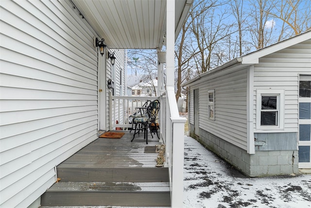 view of snow covered deck