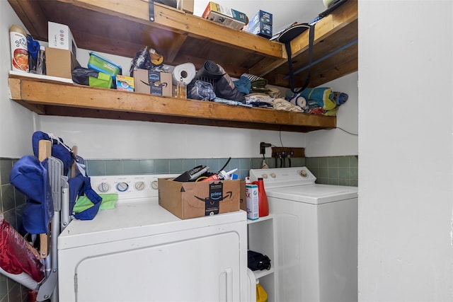 washroom with independent washer and dryer