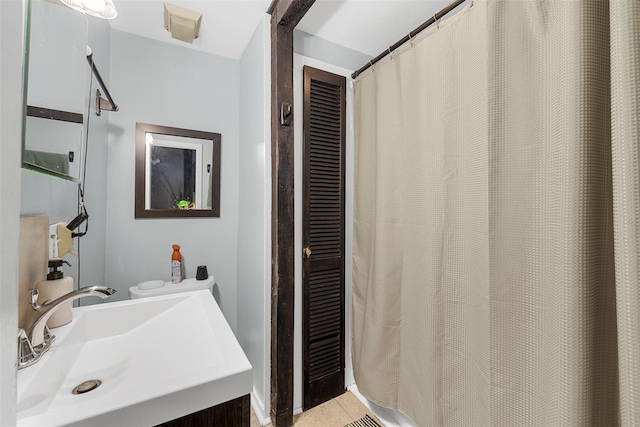 bathroom featuring tile patterned floors and vanity