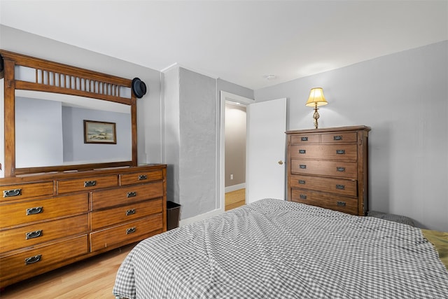 bedroom with light hardwood / wood-style flooring