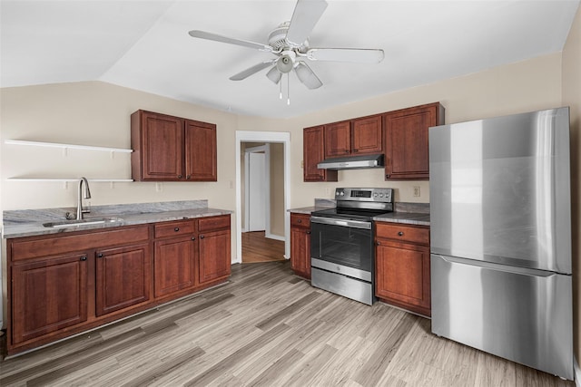 kitchen featuring appliances with stainless steel finishes, light wood-type flooring, ceiling fan, sink, and lofted ceiling