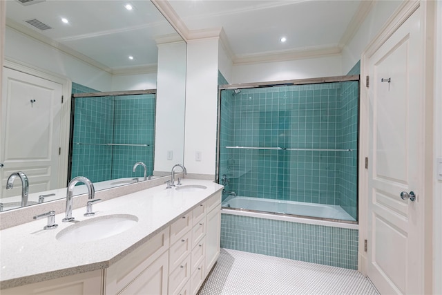 bathroom featuring tiled shower / bath combo, ornamental molding, tile patterned floors, and vanity