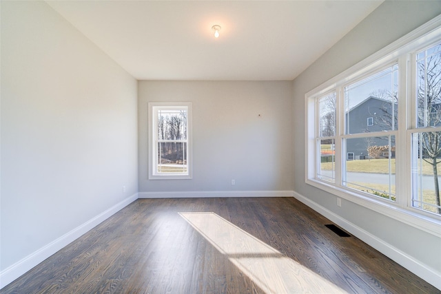 empty room featuring dark hardwood / wood-style floors