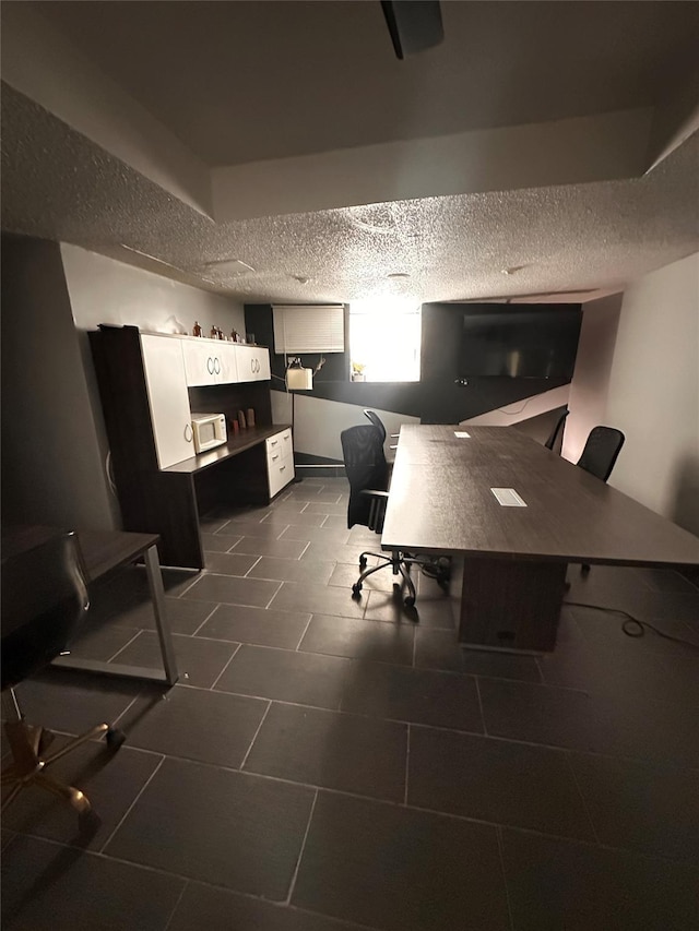 office area with a textured ceiling