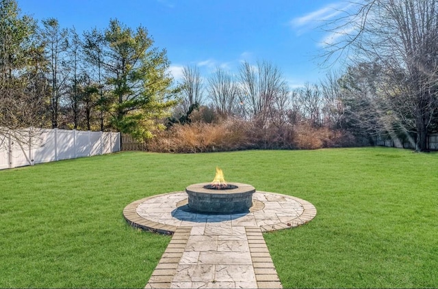 view of yard with an outdoor fire pit