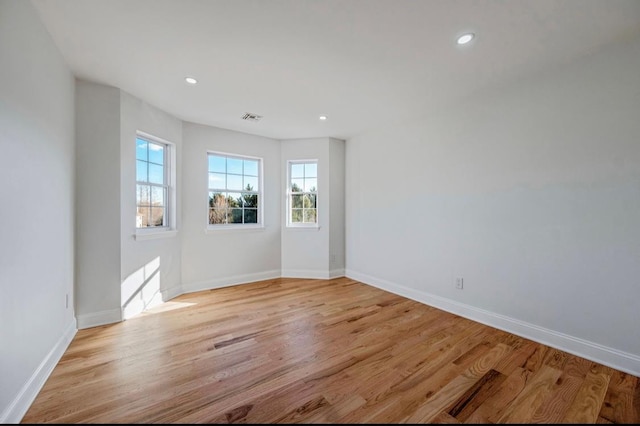 spare room featuring light wood-type flooring