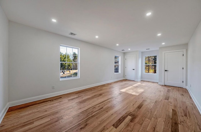 unfurnished room featuring light wood-type flooring