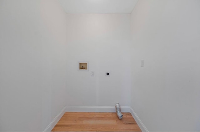 washroom with washer hookup, light hardwood / wood-style flooring, and hookup for an electric dryer