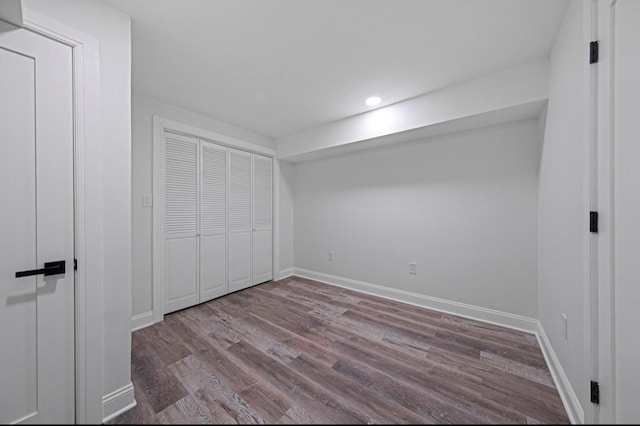 unfurnished bedroom with light hardwood / wood-style floors and a closet