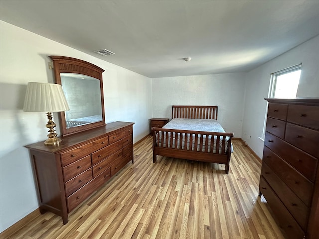 bedroom with light hardwood / wood-style flooring