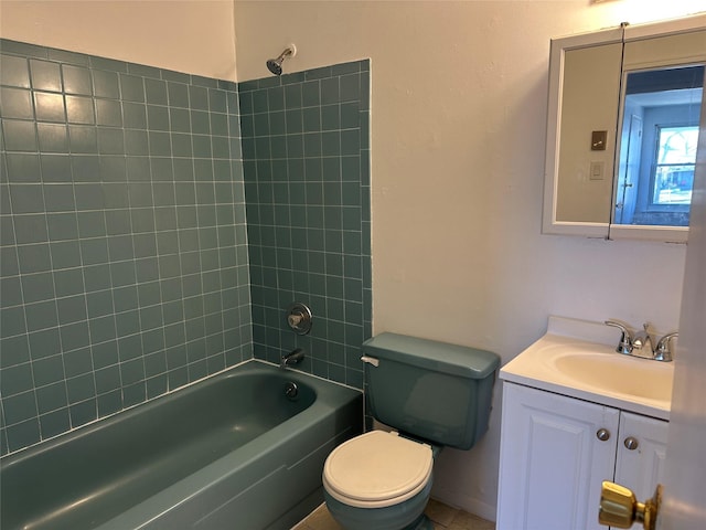 full bathroom featuring washtub / shower combination, vanity, and toilet