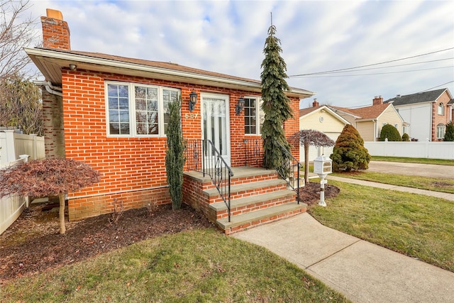 view of front of home with a front yard