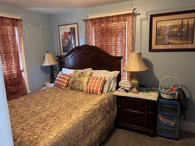 bedroom featuring dark carpet