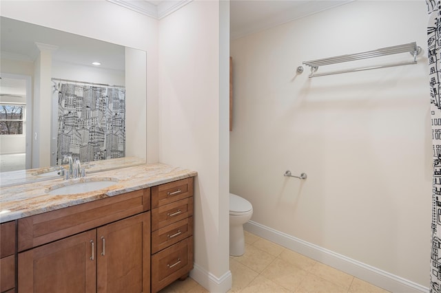 bathroom featuring toilet, vanity, and crown molding